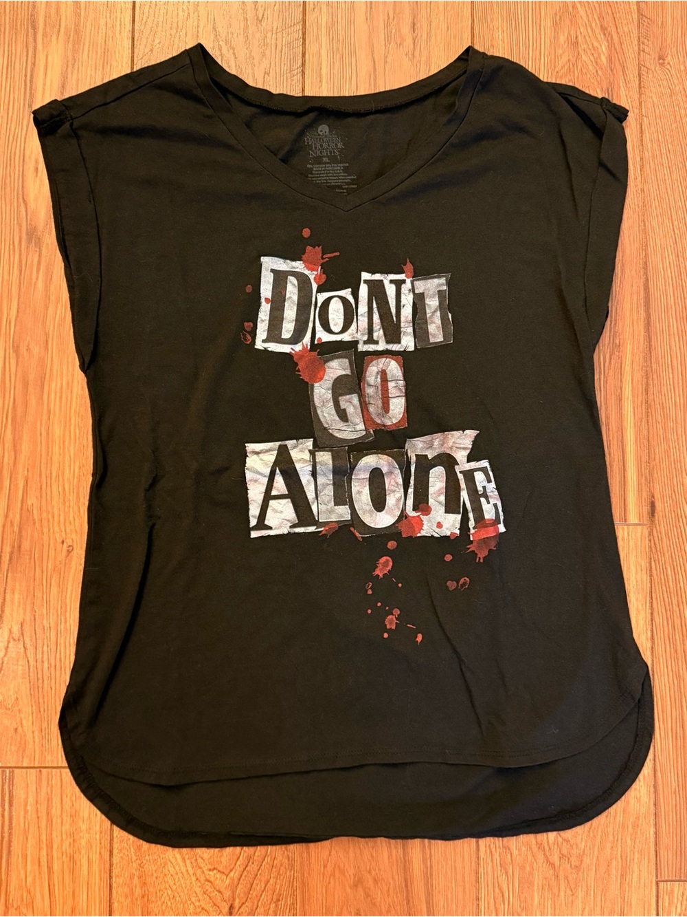 Universal Studios Black V-Neck Tee with 'Don't Go Alone' Graphic and Red Accents
